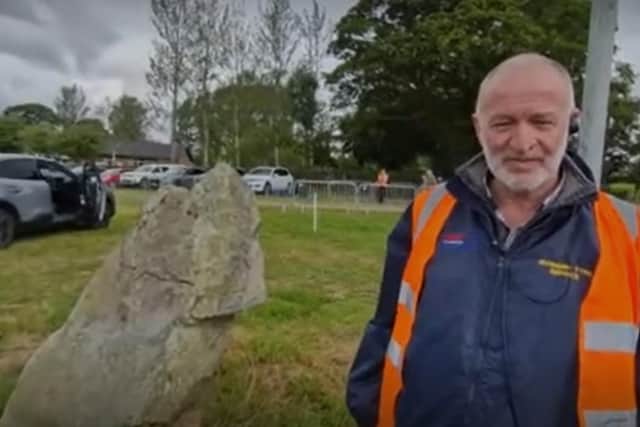 District Secretary Keith Murdock tells the story of King Billy's stone in the Loughbrickland field on 12 July 2023.