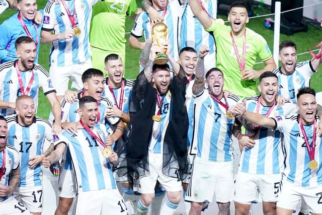 Argentina captain Lionel Messi lifts the FIFA World Cup trophy following victory over France in  the FIFA World Cup final at Lusail Stadium, Qatar.