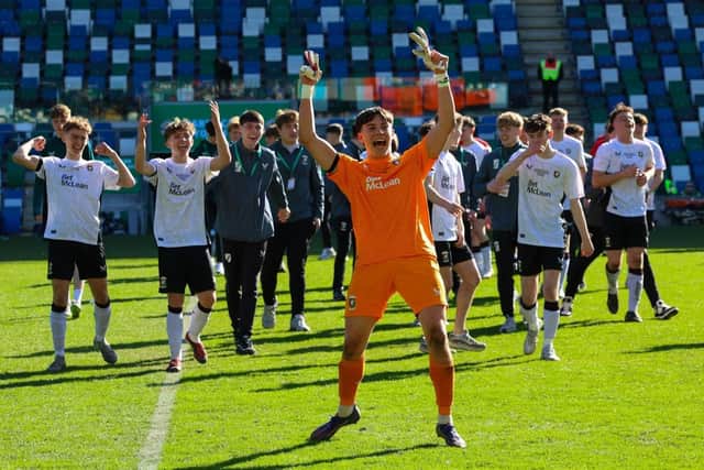 Milo Beimers celebrates after saving two penalties in the Harry Cavan Youth Cup final triumph. (Photo by Irish FA)