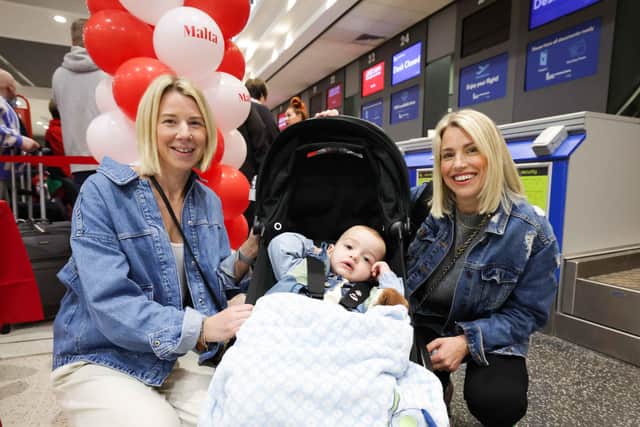 MALTA HERE WE COME:  Nicola Mahood (left), Lesley Young (right) and young Teddy Holden from Portavogie, Co Down, were amongst the first passengers to depart on the inaugural Jet2.com and Jet2holidays flight to Malta from Belfast International Airport