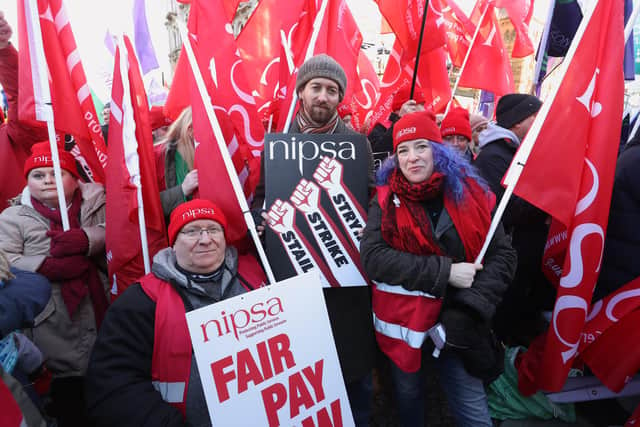 Members of NIPSA outside Belfast City Hall, Belfast, as an estimated 150,000 workers take part in walkouts over pay across Northern Ireland. The strike is set to have a major impact with schools closed, hospitals offering only Christmas Day-level services, public transport cancelled as well as limited gritting of the roads in zero-degree temperatures. Picture date: Thursday January 18, 2024. PA Photo. See PA story ULSTER Stormont. Photo credit should read: Liam McBurney/PA Wire