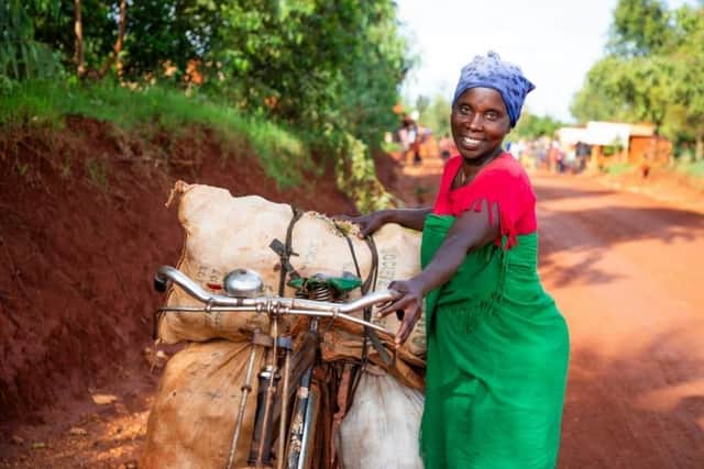 One of those supported by Christian Aid’s local partner in Burundi is Aline Nibogora. With the profits she made selling her avocados and peanuts, Aline bought a bicycle to transport her goods further afield. Credit: Christian Aid/Ndacayisaba Epitace