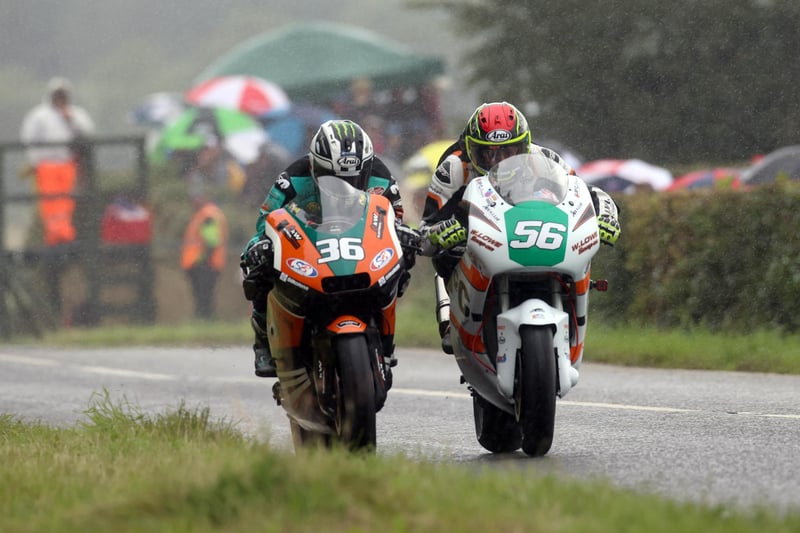 There wasn't much space as Michael Dunlop (KTS Racing Kawasaki) passed Adam McLean (J McC Roofing Racing Kawasaki) to take the lead in the Supertwin race at Armoy in the wet on Saturday