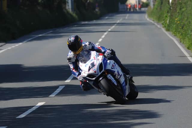 Guy Martin in action on the Tyco Suzuki GSX-R1000 Superbike in the Senior race at the 2013 Isle of Man TT.