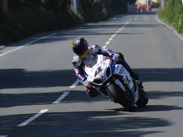 Guy Martin in action on the Tyco Suzuki GSX-R1000 Superbike in the Senior race at the 2013 Isle of Man TT.