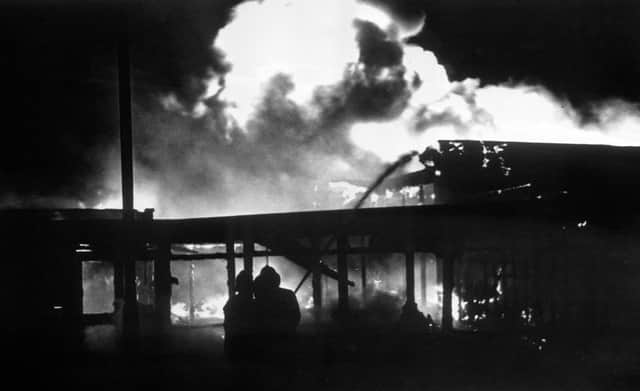 Firemen tackle the fire at La Mon House restaurant near Belfast 45 years ago on February 17 1978 when at 12 people died and 23 were injured in a bomb blast.