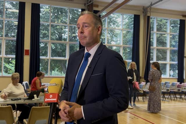 Stormont Education Minister Paul Givan speaks to the media after meeting with students collecting their GCSE results at Dromore High School in Dromore, Co Down
