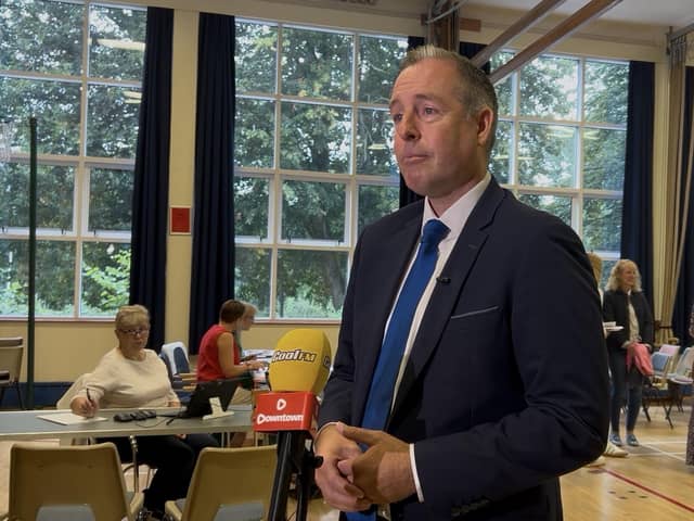 Stormont Education Minister Paul Givan speaks to the media after meeting with students collecting their GCSE results at Dromore High School in Dromore, Co Down