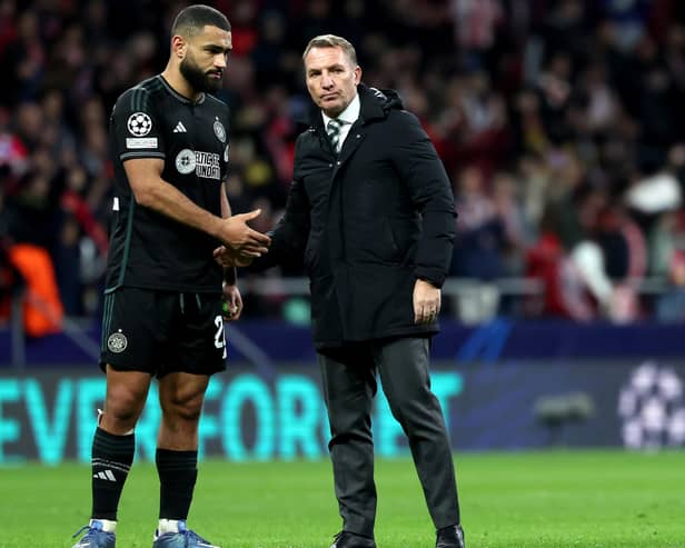 Celtic manager Brendan Rodgers and Cameron Carter-Vickers (left) commiserate at the final whistle following a chastening 6-0 Champions League defeat against Atletico Madrid on Tuesday