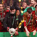 Jurgen Klopp, Manager of Liverpool, celebrates with the Carabao Cup trophy after his team's victory during the Carabao Cup Final match between Chelsea and Liverpool at Wembley Stadium on February 25, 2024 in London, England. (Photo by Julian Finney/Getty Images)