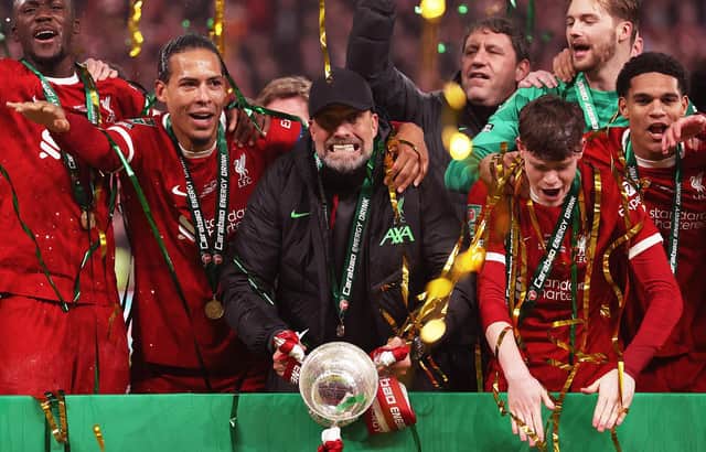 Jurgen Klopp, Manager of Liverpool, celebrates with the Carabao Cup trophy after his team's victory during the Carabao Cup Final match between Chelsea and Liverpool at Wembley Stadium on February 25, 2024 in London, England. (Photo by Julian Finney/Getty Images)