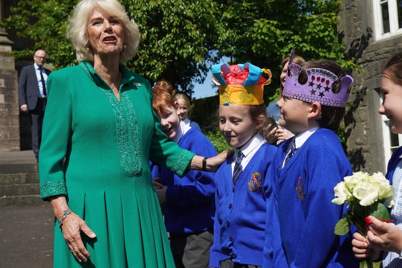 Queen Camilla meets Camilla Nowawakowska aged 8 and Charles Murray aged 8 from Armstrong Primary School Armagh outside St Patrick's Cathedral in Armagh