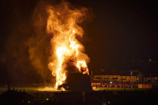 Some bonfires did not have representations of people on them but were set ablaze adorned with Irish Tricolours. Mr Bryson says he draws a distinction between the burning of such depictions of people and the burning of flags. Photo: Liam McBurney/PA Wire