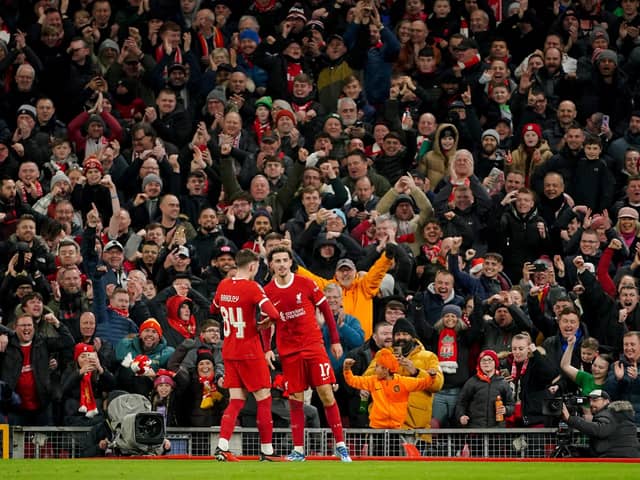 Liverpool's Curtis Jones celebrates his goal with team mate Conor Bradley against Fulham at Anfield during the Carabao Cup quarter-final