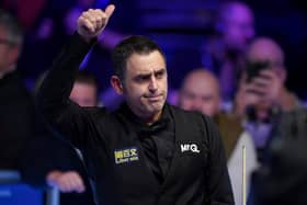 Ronnie O'Sullivan celebrates victory in the MrQ Masters Final against Ali Carter (not pictured) at Alexandra Palace on Sunday