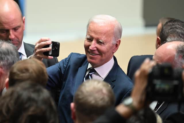 President Joe Biden is pictured taking a 'selfie' with invited guests at Ulster University on April 12, 2023 in Belfast, Northern Ireland. Photo by Charles McQuillan/Getty Images