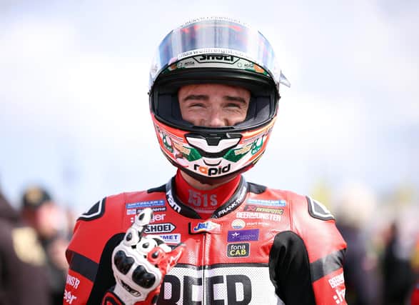 Glenn Irwin smiles for the camera during the opening NW200 practice session