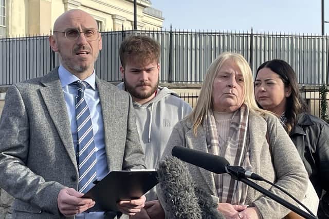 Detective Chief Inspector Anthony Kelly speaks to the media, alongside Jimmy Thompson's partner Sandra Agnew, her daughter Debbie and grandson Dean, outside Newry Courthouse on Wednesday