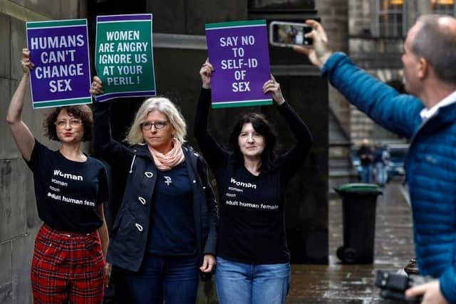 Scottish feminist campaigners in Edinburgh in December, protesting against changing the law to let people swap gender more easily; another law forbidding the 'stirring up of hate' towards people who say they are transgender has since taken effect in Scotland