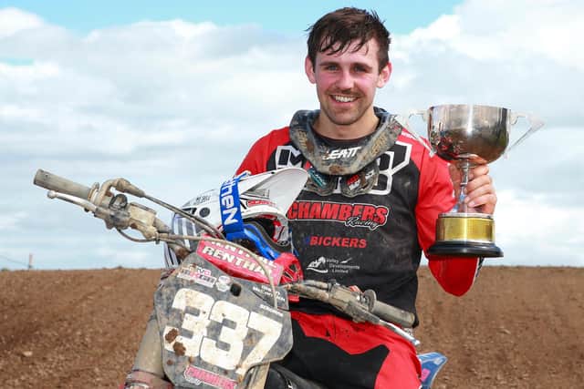 Glenn McCormick with the Billy Hutton Memorial Trophy after winning all three MX2 races at Saul. Picture: Maurice Montgomery