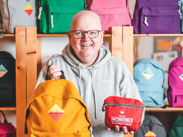 Northern Ireland social enterprise Madlug is celebrating its eighth birthday by marking a significant milestone of distributing 75,000 pack-away travel bags to children in care.  It puts them well on their way to reaching the 100,000 target by next year while the bag was also recently featured in the Take That musical film Greatest Days starring Aisling Bea. Pictured is Madlug founder Dave Linton