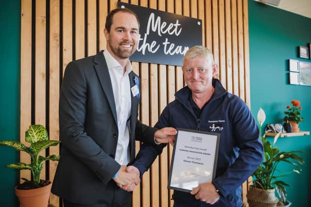 Steven Thompson pictured receiving is award from M&S Agriculture Manager, Peter Kennedy.
