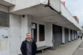 Danny Donnelly MLA outside the vacant retail unit on Larne's Main Street. (Pic: East Antrim Alliance Party).
