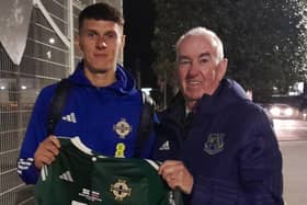 Eoin Toal meets up with Armagh City chairman Aidan Murphy after making his first Northern Ireland appearance against Slovenia at Windsor Park, Belfast. PIC: Armagh City FC