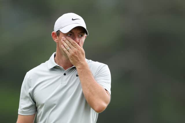 Rory McIlroy reacts to a putt on the 18th green during the second round of the 2023 Masters Tournament at Augusta National Golf Club.