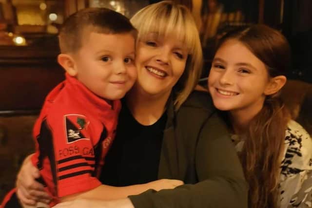 Michelle Hoy with Caiden and Katie, who suffers from brittle asthma