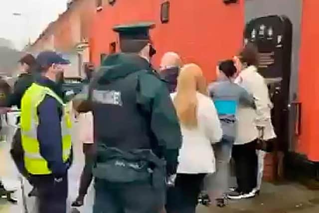 The scene on the Ormeau Road as police attempted to identify the organisers of a Troubles memorial event during the Covid lockdown in February 2021. Photo: Pacemaker