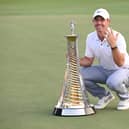 Rory McIlroy poses with the Race to Dubai trophy on the 18th green during Day Four of the DP World Tour Championship on the Earth Course at Jumeirah Golf Estates