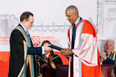 Queen's President and Vice-Chancellor Professor Sir Ian Greer presents President Obama with an honorary degree at Queen's University