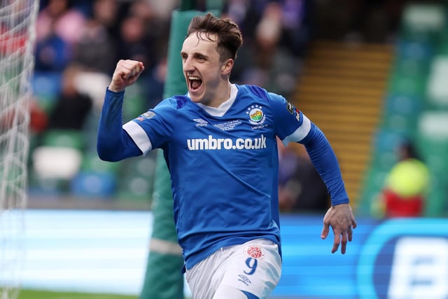 Joel Cooper wheels off in celebration after opening the scoring for Linfield