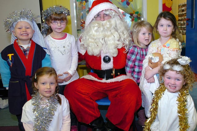 It was a case of smiles all round from pupils from Moneymore Nursery Unit when they were pictured with Santa Claus last Thursday morning after their Christmas play.mm52-327sr
