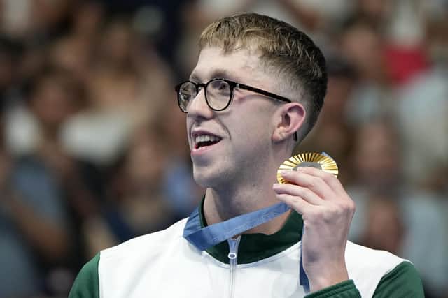 Gold medalist Daniel Wiffen holds his gold medal for the men's 800-meter freestyle final at the 2024 Summer Olympics on Tuesday night