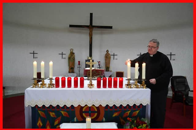 Father John Joe Duffy lights ten red candles candles at St Michael's Church in Creeslough Co Donegal, for the ten victims of the Applegreen service station explosion as he prepares for Mass. Picture date: Sunday October 9, 2022. PA Photo. Friday's blast at the service station in Creeslough, Co Donegal is being treated by Irish police as a "tragic accident". The huge explosion claimed the lives of four men, three women, two teenagers â€“ a boy and girl â€“ and a girl of primary school age. See PA story IRISH Donegal . Photo credit should read: Brian Lawless/PA Wire