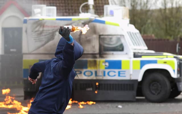 Youths throw petrol bombs at a PSNI vehicle ahead of a dissident Republican parade in the Creggan area of Londonderry on Easter Monday. Authorities have increased security measures in response to the unnotified parades being held in Derry. Picture date: Monday April 10, 2023.
