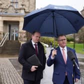 DUP leader Jeffrey Donaldson (right) and MLA Gordon Lyons speaking to the media outside Stormont Castle where party representatives met with Jayne Brady, head of the Northern Ireland Civil Service, to discuss budget issues