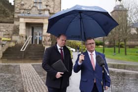 DUP leader Jeffrey Donaldson (right) and MLA Gordon Lyons speaking to the media outside Stormont Castle where party representatives met with Jayne Brady, head of the Northern Ireland Civil Service, to discuss budget issues