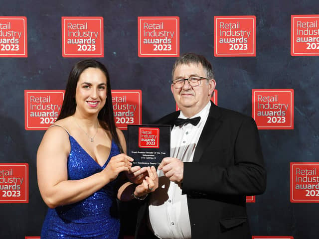 Castlederg retailer bags prestigious national award in London. Pictured is Alison Logue and Charlie Hamilton from Hamilton's SPAR with their award for Independent Fresh Produce Retailer of the Year at the Retail Industry Awards in London