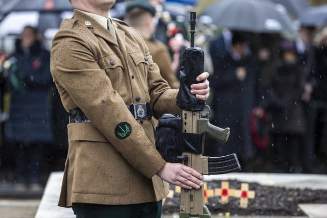 Cenotaph sentinel stands to holding his weapon during the Remembrance Sunday service at the Cenotaph in Enniskillen. Picture date: Sunday November 12, 2023.