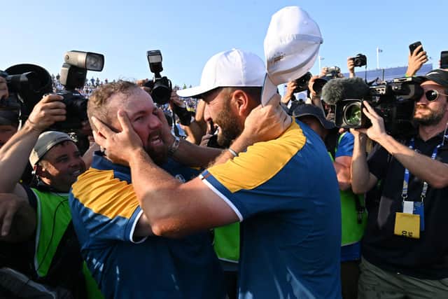 Team Europe's Jon Rahm (R) and Shane Lowry (L) embrace after their victory on the final day of the Ryder Cup in Rome in October