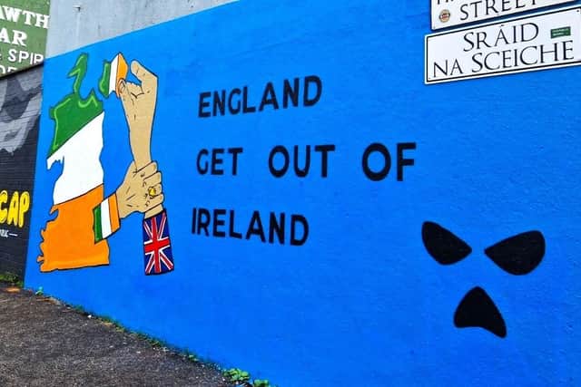 One of the group's two murals in west Belfast, complete with balaclava logo