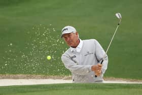 Fred Couples of the United States plays a shot from a bunker on the 16th hole during a practice round prior to the 2023 Masters Tournament at Augusta National Golf Club.