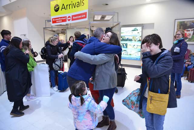 Emotional scenes as families are reunited for Christmas at Belfast City Airport, Northern Ireland. Picture: Arthur Allison/Pacemaker Press.