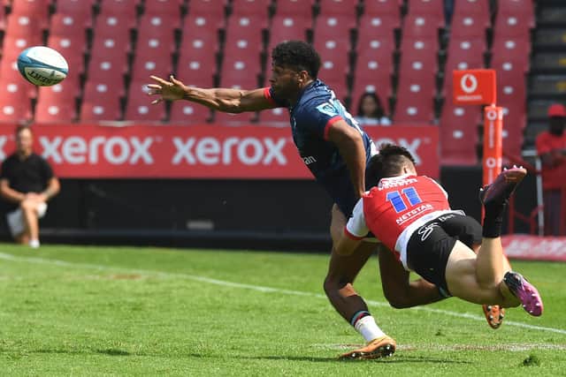 Ulster’s Robert Baloucoune passes under pressure during the United Rugby Championship match against Emirates Lions in Johannesburg