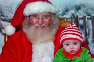 FIRST TIME. Pictured visiting Santa for his first Christmas is little Caoimhin Brogan from Ballycastle, who was captured with Mr Claus in Victoria Square, Belfast. Our thanks to Caoimhin's Aunt Christine Reid for sending us the picture. Happy Christmas Caoimhin.INBM51-10 9011F.