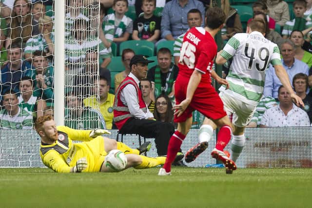 Conor Devlin makes a fine save from a James Forrest shot at Celtic Park. PIC: Rob Hardie/ Presseye