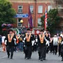 Members of the Orange Order parade in Belfast during the traditional Twelfth commemorations